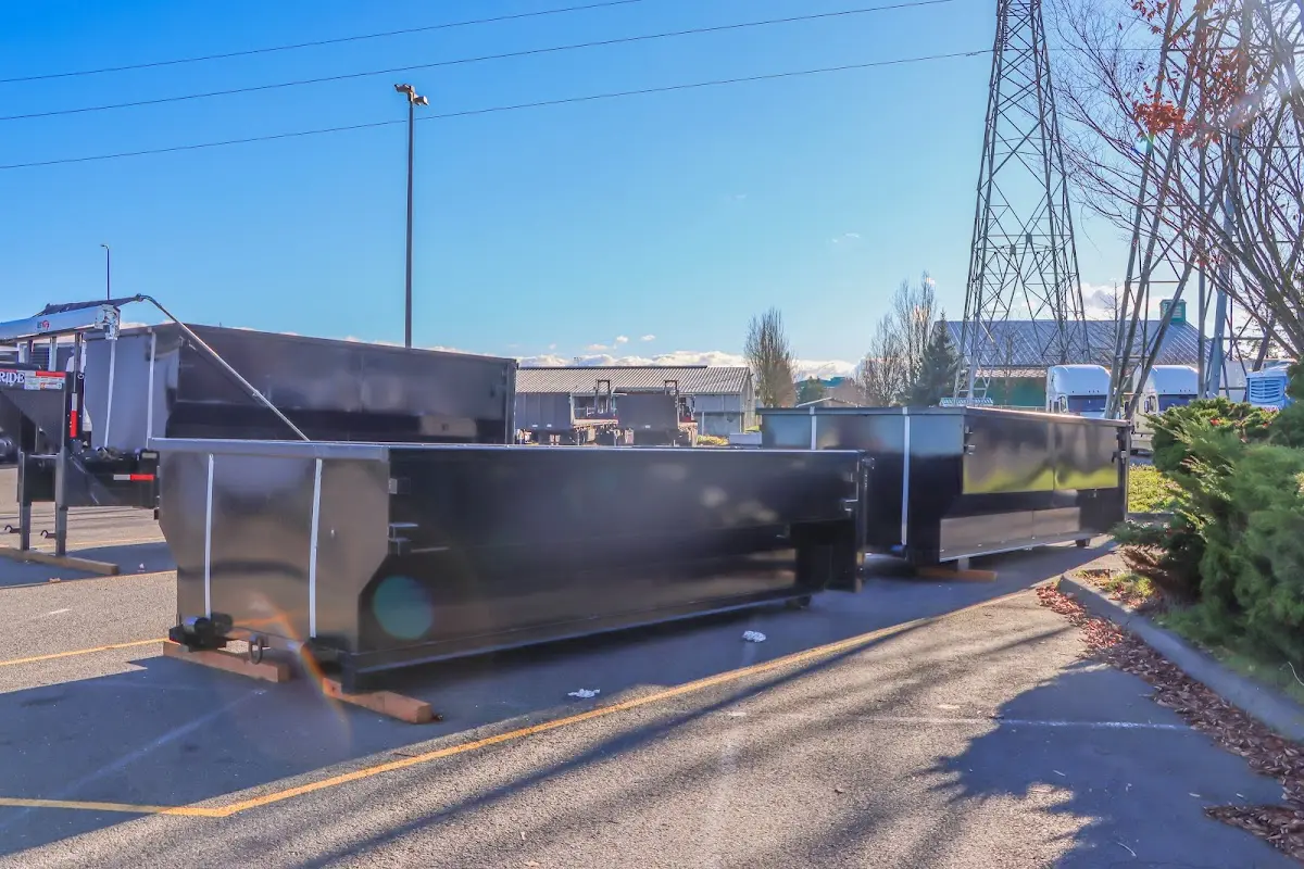Roll-off dumpster ready for waste disposal at job site for Yard Waste Dumpster Rental in Greenville